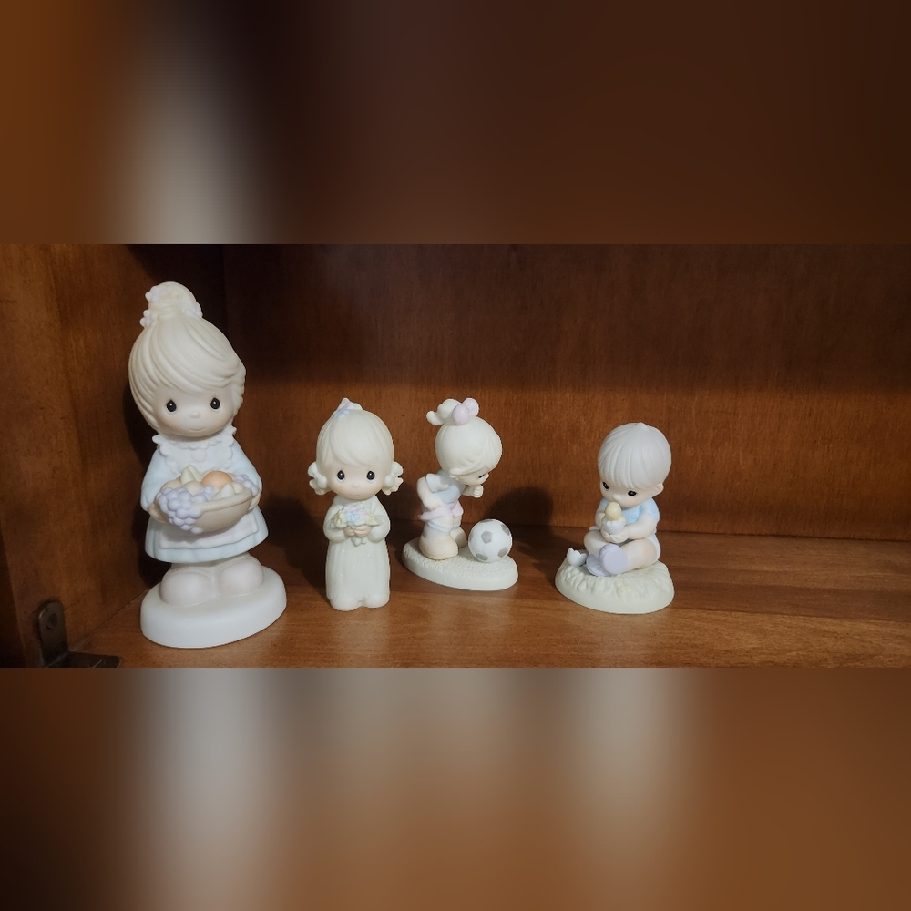 4 precious moments figurines